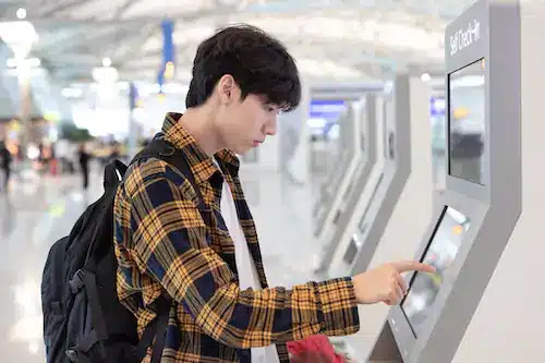 person using kiosk machine at events